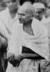 Mohandas Karamchand Gandhi smling at crowd.